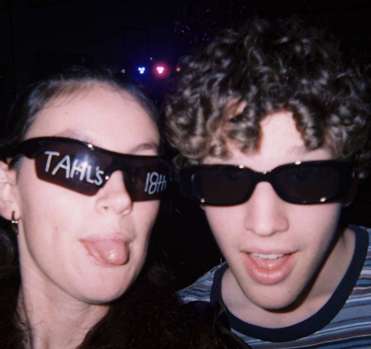 Tate and Lily posing at party