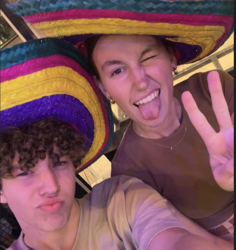 Tate and Lily wearing mexican hats posing